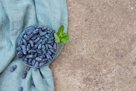 honeysuckle berries on a concrete background.の写真素材