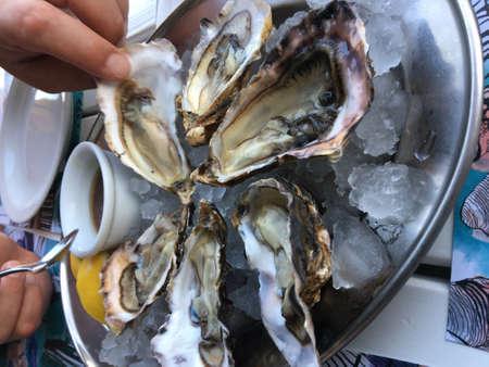 Fresh oyster shell on ice. seafood in the restaurant. Raw foodの写真素材