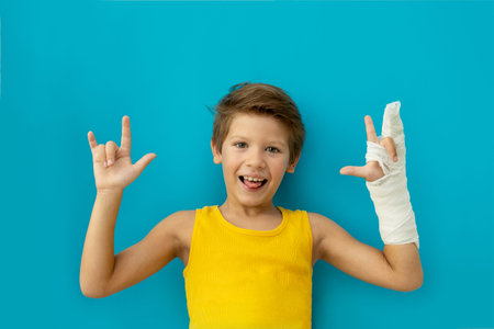 A child with a plaster on his hand. Copy space.