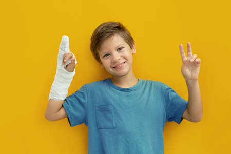 A child with a plaster on his hand. Copy space.の写真素材