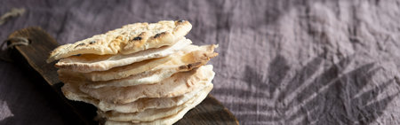 banner. Homemade matzo with microgreen peas. Unleavened flatbread bread. Pesah celebration concept....