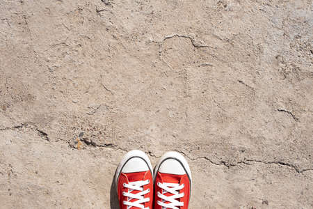 Red sneakers on a concrete background. copy space. Way, roadの写真素材