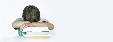 Banner. Sad boy with book does school homework. Back to school. Unhappy schoolboy with books....