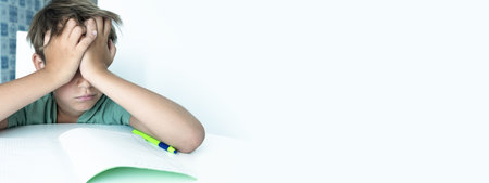 Banner. Sad boy with book does school homework. Back to school. Unhappy schoolboy with books....