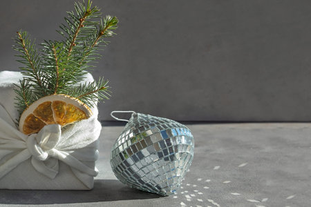 Japanese packaging of furoshiki in eco-friendly fabric. New Years minimalistic dark gray trending...