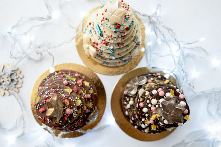 Christmas tree with edible decorations in box. Christmas food, homemade chocolate dessert. Creative...
