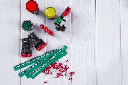 Group of electronic components and parts on white background.