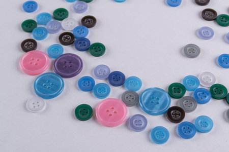 Collection of Colourful Sewing Buttons on white background