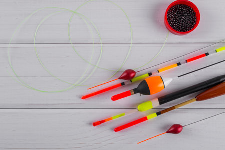 Set of fishing floats  on a wooden white background.
