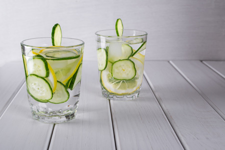 Refreshing  cucumber  cocktail, lemonade, detox water  in a glasses on a white background. Summer drink.の写真素材