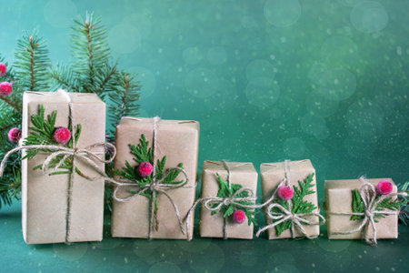 Row of  Christmas gift box and decorations. Old fashion style. On green bright background.