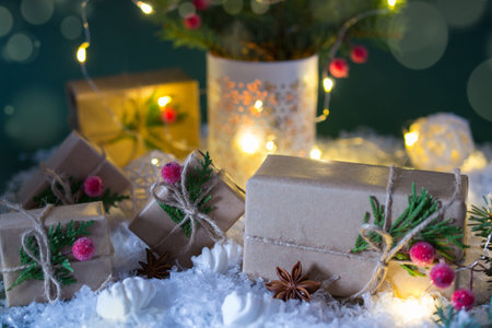 Packing Christmas gifts. Craft gift boxes and decorations . On green  backgroundwith lights.