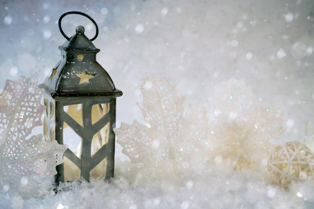 Winter background. Beautiful candlestick in the shape of a house in a snow fairy forestの写真素材