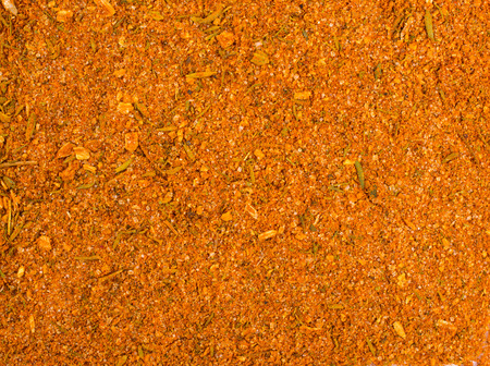Texture background. Yellow spice mix for chicken  . Spices consist paprika onion garlic mustard coriander thyme celery turmeric fennel black pepper の写真素材