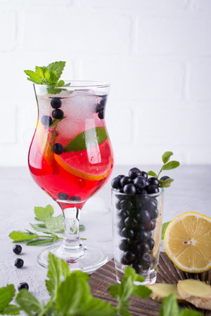 Fresh blueberry summer mojito cocktail. Blueberry lemonade or sangria on whiteの写真素材