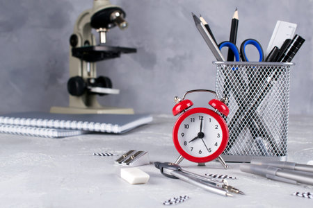 Minimalistic school or office workspace with gray stationery on concrete background. Education concept. Back to school.の写真素材