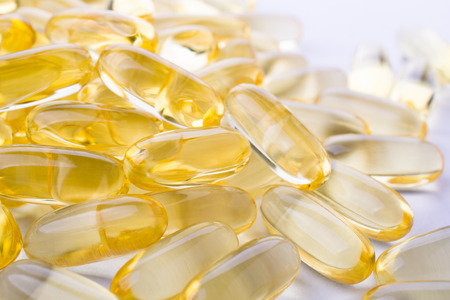 Close up of capsules Omega 3 on white background. Top view, Health care conceptの写真素材