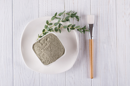 Beauty concept. Flat lay, clay mud powder natural ingredient for homemade facial and body mask or scrubの写真素材