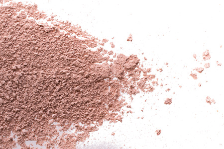 Cosmetic background, minerl clay texture. Pink ask dry clay for facecare and bodycare. Isolated on a white backgroundの写真素材