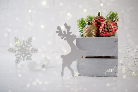 Christmas home decoration with  green fir branches, deer and lights on white background. Mock-upの写真素材