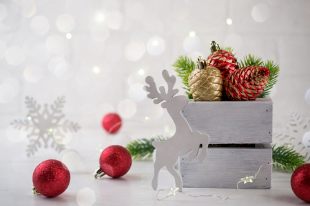 Christmas home decoration with  green fir branches, deer and lights on white background. Mock-upの写真素材