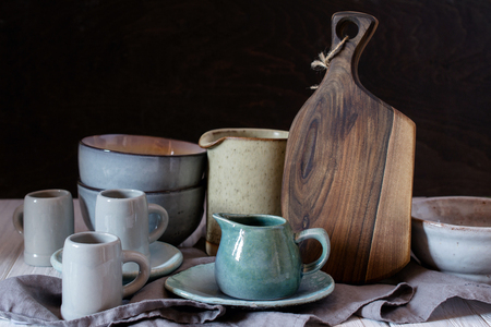 Collection of rustic simple handcraft kitchenware in neutral tones on grey backgroundの写真素材