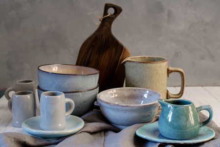 Collection of rustic simple handcraft kitchenware in neutral tones on grey backgroundの写真素材