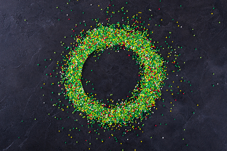 Sugar sprinkle dots, decoration for cake and bakery, as a background. On blackの写真素材