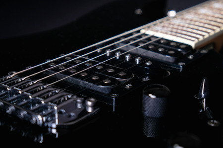 Close-up of a humbucker. Detail of six-string electric guitar, soft selective focus.の写真素材