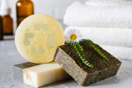 Natural cosmetic oil and natural handmade soap with loofah . Healthy skin care. SPA concept