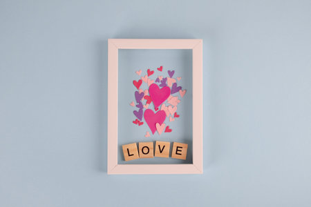 Word love and hearts on blue background. Valentine's Day background. Valentines day, Mothers day,...