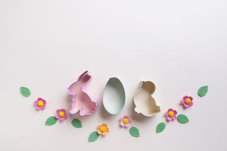 Easter cookies cutters and sweet decorations isolated on a white