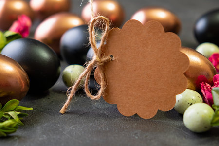 Blank brown tag with Easter eggs. Happy Easter greeting card 