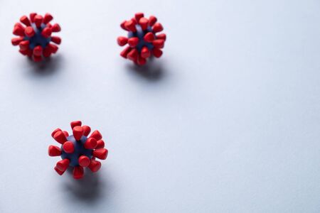 Plasticine model  of coronavirus bacteria 
or  other virus  on blue background. Place fo textの写真素材