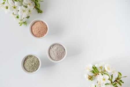 Set of different cosmetic clay mud powders on white backgroundの写真素材