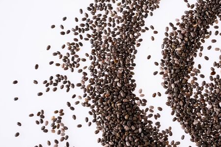 Abstract group of chia seeds isolated on white background. Closeup. Top view. Chia super food.の写真素材
