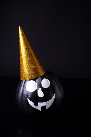 Scary Halloween pumpkin isolated on a black background. Scary faces trick or treat