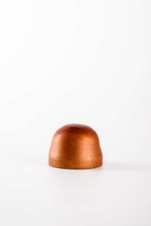 Closeup of chocolate hand painted candy bonbons on a white background. Modern chocolate design.の写真素材