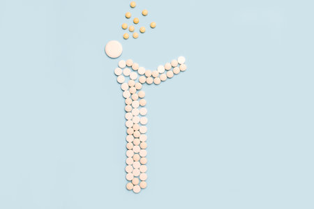 Man coughs. Influenza, colds, coronavirus. Infection through an airborne droplet. A guy made of pills is coughing.の写真素材