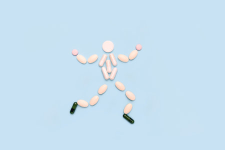 Healthy happy man made of pills. The concept of a timely health checkの写真素材
