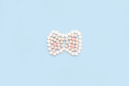 Thyroid gland made of pills. A symbol of protection and prevention from thyroid diseasesの写真素材