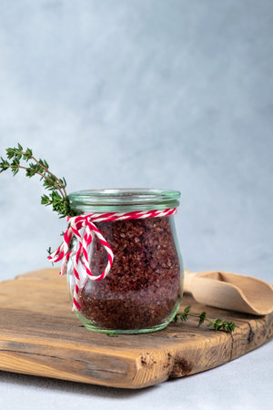 Red wine flavored salt in a glass jar. Gourmet condiment to aromatize and season food Dessert,...