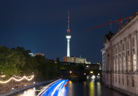 Night view on the TV Tower in Berlin and river Spree