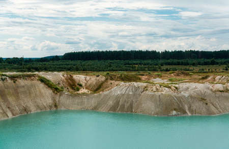 chalkpit with blue waterの写真素材