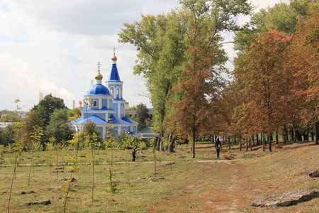 Autumn Park and blue Church