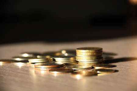 Stacks of coins on the tableの写真素材
