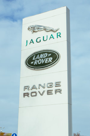 The logo of the famous automotive companies Jaguar, Land Rover and Range Rover, on a blue sky background. December 4, 2019のeditorial素材