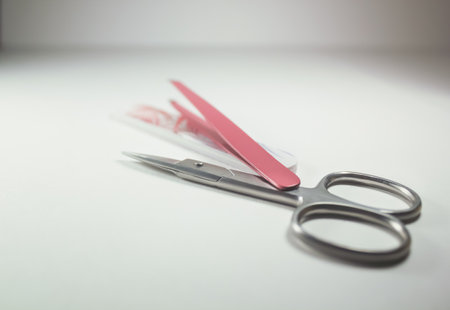 Manicure set, tools: scissors, eyebrow tongs, nail clippers, nail file on white backgroundの写真素材