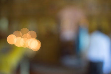 Abstract warm coloured blurred background of church interiorの写真素材