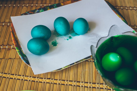 Coloring eggs for Easter in paint.の写真素材